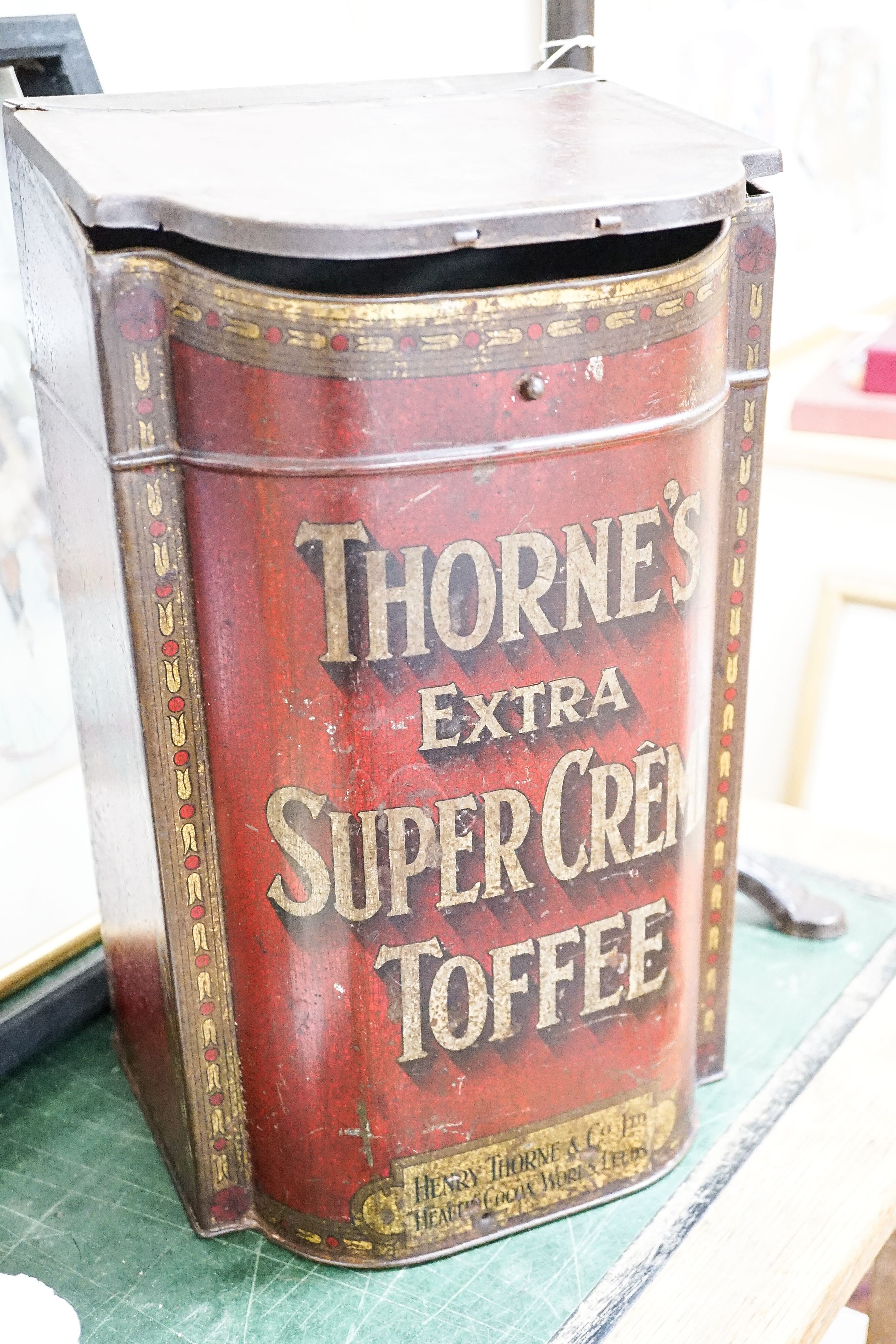 A mannequin on cast iron stand, height 103cm, and a retailer's Thorne's Toffee can